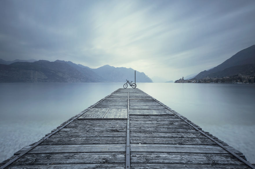 bike on lake in mountains of italy